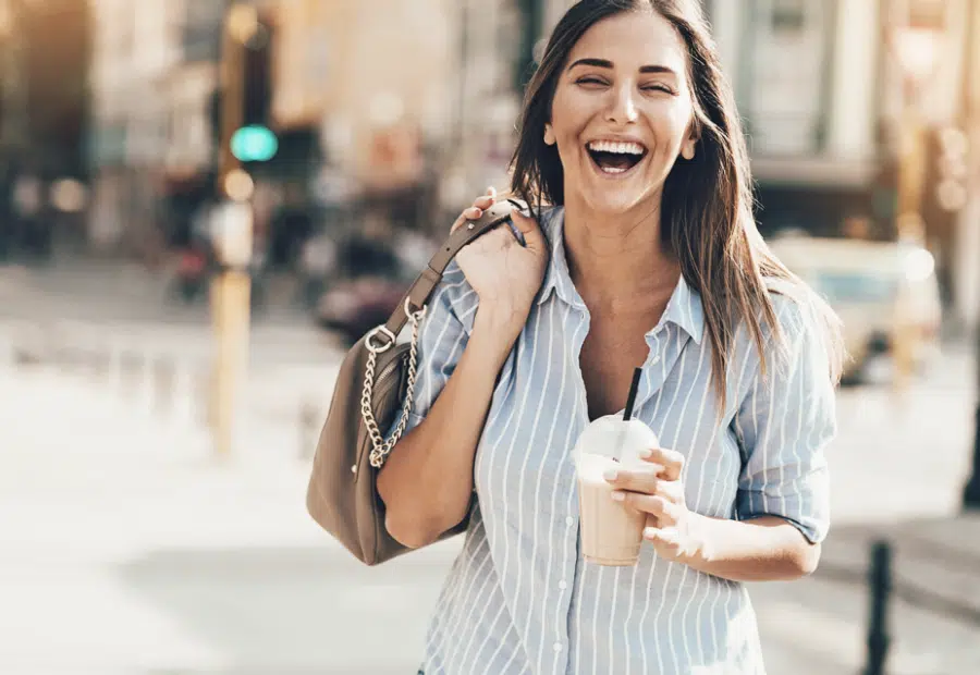 financial wellness woman laughing happy