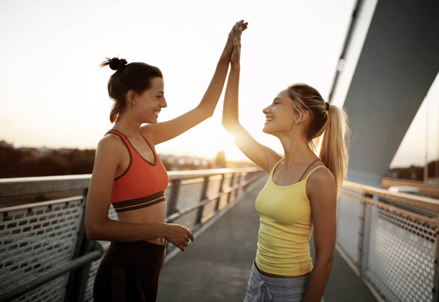 physical wellness women exercising outdoors