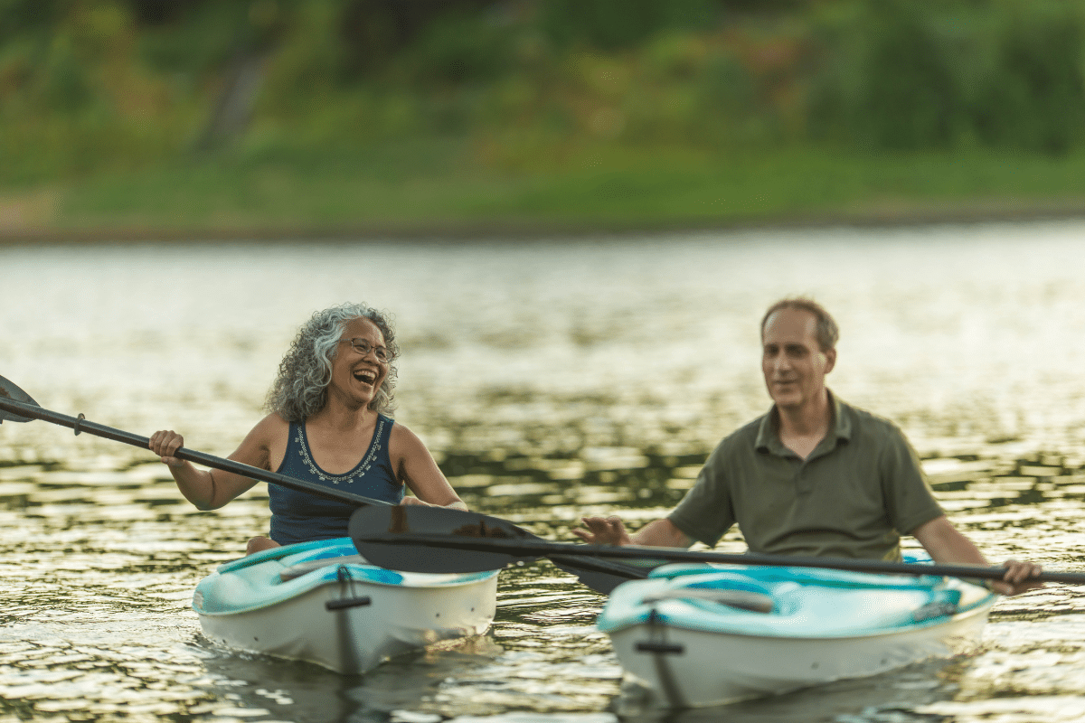middle aged couple kayaking